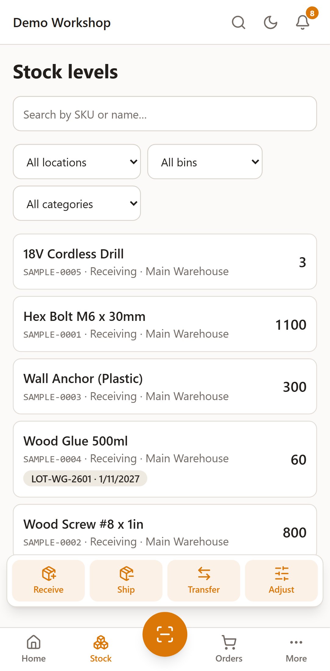 Mobile stock levels with on-hand quantities per bin, a lot badge, and receive, ship, transfer and adjust actions